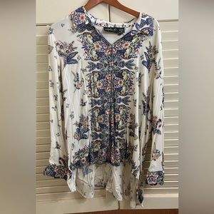 Asymmetrical, button up shirt.